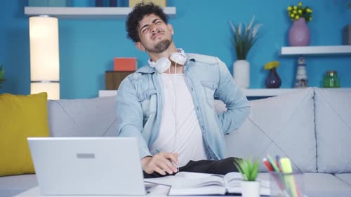 College student suffering from back pain.