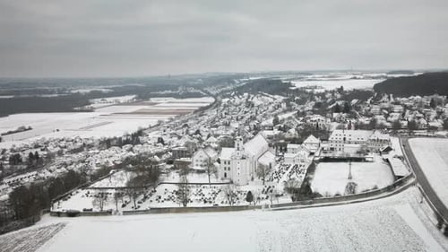 Gliding Forward Drone Snowy Village Sweep