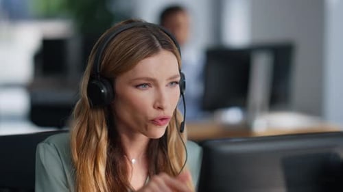 Technical Support Operator Consulting Client Wearing Headset at Office Closeup