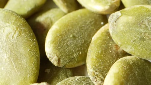 Vividly hued green pumpkin kernels.