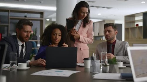 Diverse Corporate Group Discuss Financial Plan In Office. Multiracial Business Team Using Laptop ...
