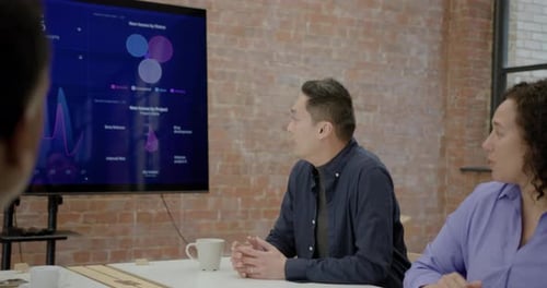 Businessman Presenting in Office during Meeting