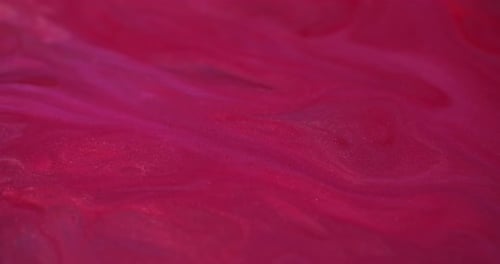 Magenta Paint with Gold Sparkles Rippling Slowly