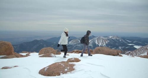 Couple Hiking Summit of Rocky Mountains, Climbing, Hiking Peak Adventure