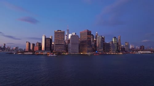 Manhattan Skyscrapers Glowing Golden Shot From a Unique Triopod Perspective Reflecting Vibrant City