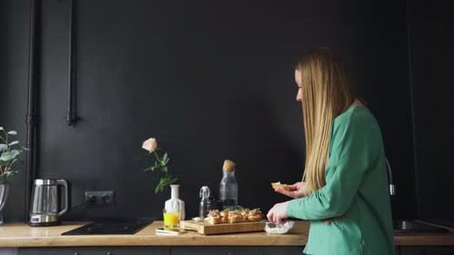 Woman Prepares Food Then Celebrates Good News