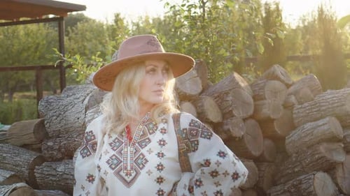 Beautiful Blonde Woman in Hat and Embroidered Shirt in Sunset Rays Closeup Portrait Boho Style