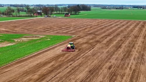 Aerial Tracking of Tractor with Seed Drill Sowing Spring Crop on Vast Plowed Field in Latvia