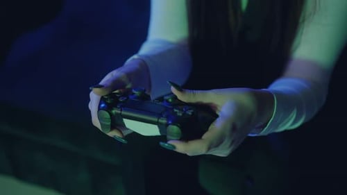 Close Up of Woman with Manicure Playing Video Games Using Wireless Controller Futuristic Gaming