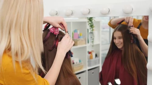 Woman Getting Hair Styled at Bright Salon