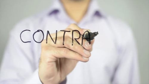Man Writing Contract on Glass Surface