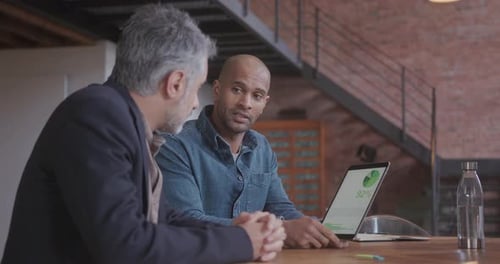 Two Business Men Meeting in Creative Office with Technology