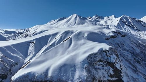 Aerial view of beautiful snowy mountains in Gudauri, Georgia