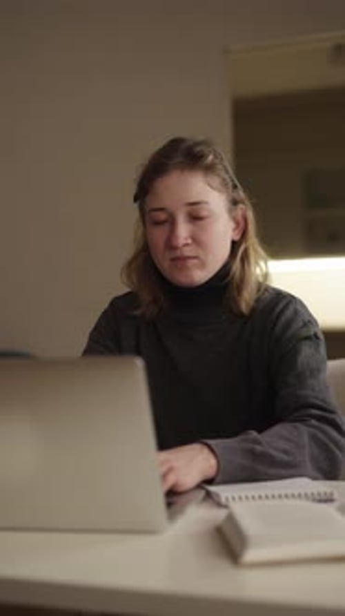 Vertical Portrait of Female Student with Cerebral Palsy Struggling to Stay Awake While Studying Late