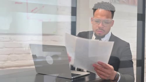 Excited Business Man Celebrates Good News at Office