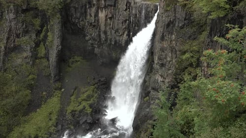 Waterfall in Iceland. Spectacular Icelandic waterfall. The harsh beauty of the Arctic nature.