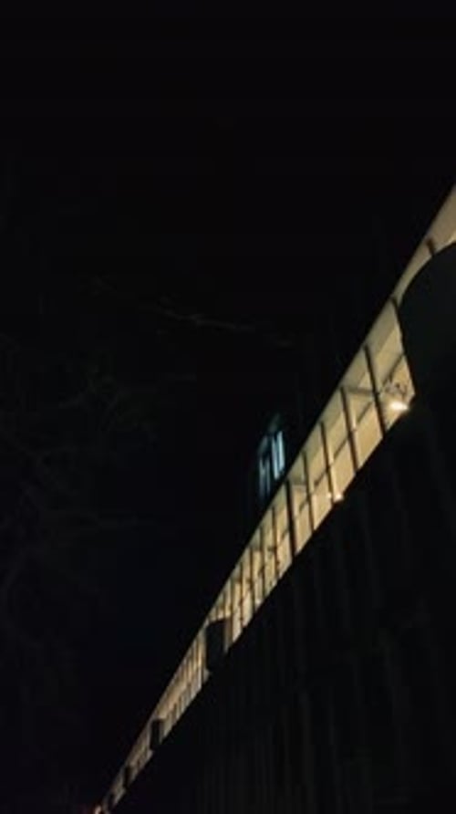 Lit Row of Apartment Balcony at Night in Amsterdam Noord