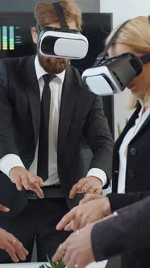 Businesspeople Using Virtual Reality Headsets in Modern Office