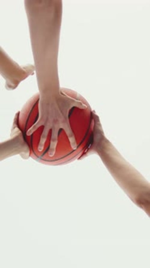 Close Up of Hands on a Basketball