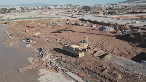 Excavator aerial footage on the big construction site, heavy machinery