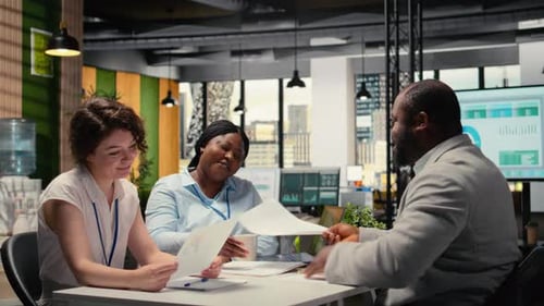 Recruiting Team and an Applicant Engaging in CV Evaluation in a Business Office