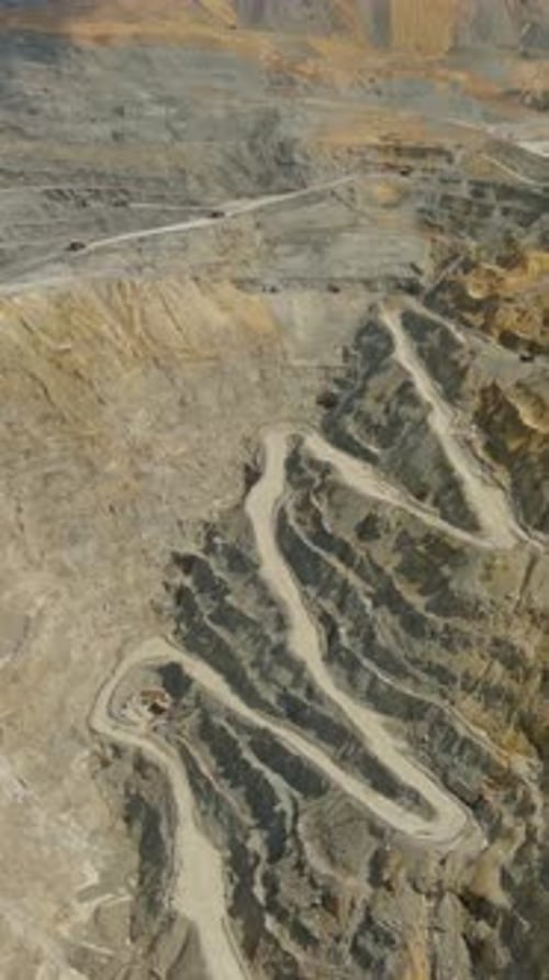 Aerial of Open Mine and Heavy Mining Equipment