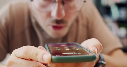 Close Up of Caucasian Man in Glasses Recording Voice Message on Mobile Phone At Home Indoor Male