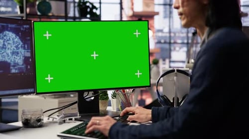 AI Startup Office Senior Developer Building Application on Green Screen Computer