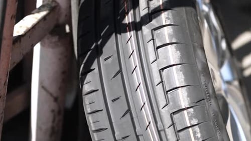 Car wheel service. Mechanic changing tires and rims, balancing the wheels
