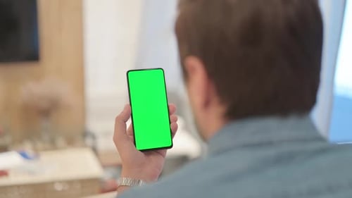 Man Using Phone with Green Screen
