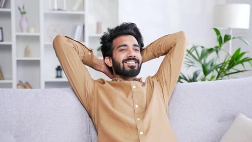 Man Resting Peacefully on Sofa in Living Room