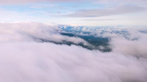 Aerial view morning scenery Mist flowing over the high mountains.