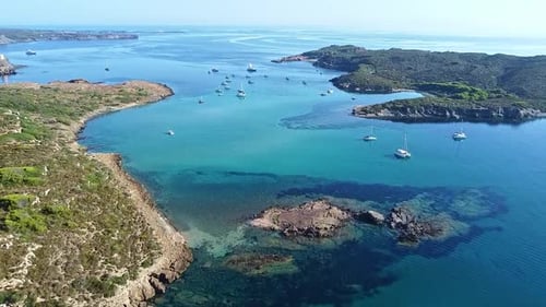 Aerial View of Turquoise Bay with Sailboats