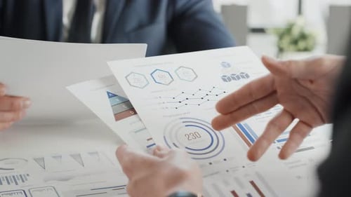 Business Meeting with Data Analysis at Modern Workplace