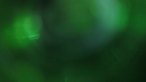 Illuminate Collection: Fading out light leak transition with a green hue