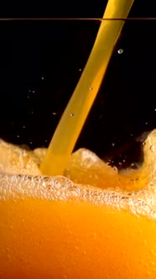 Pouring Fanta Cocktail With Orange Juice in Slow Motion at 1000 Fps Captured in