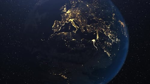 Sunrise over the European continent view from space. Camera zooms out and night cities lights go out