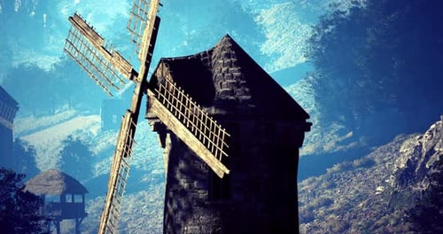 Historic Windmill Stands Tall Against a Serene Landscape During Daylight Hours