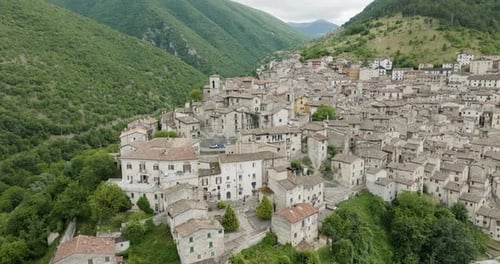 Aerial view of the town nestled in the hills, Italy.