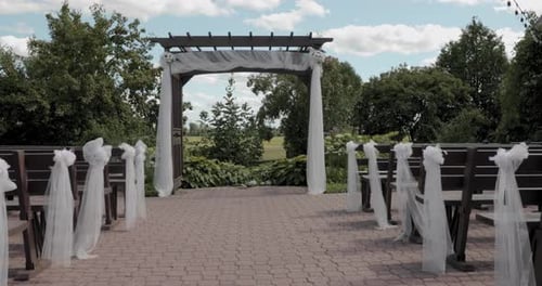 Gorgeous outdoor stone patio wedding ceremony are at the Strathmere events center during a beautiful