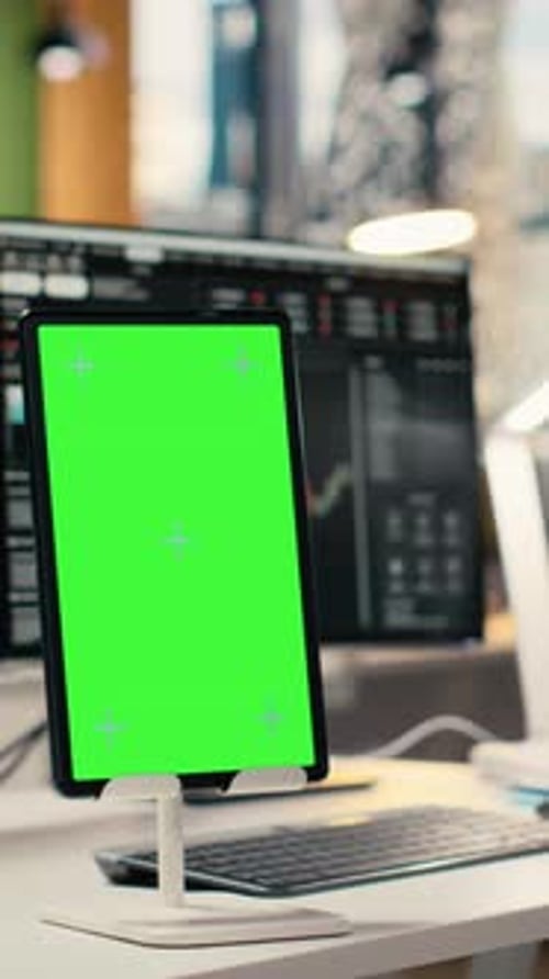 Vertical Video Close Up of Isolated Screen Tablet Displaying Stock Market Graphs in Office