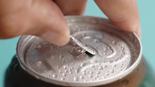 Hand Opens Can of Beer