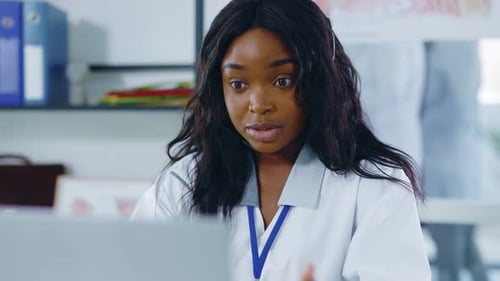 Healthcare Worker on Video Call in Medical Office