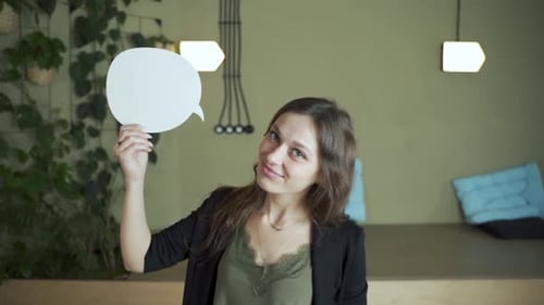 Student brunette hair female European student points cloud arrow to describe text dialogue. Looking