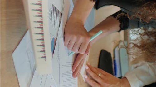 Signing Documents on Desk at Workplace