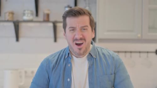 Surprised Man Reacting in Indoor Home Setting