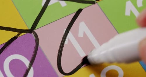 CloseUp Image of a Calendar with Date Marked in Black Circle