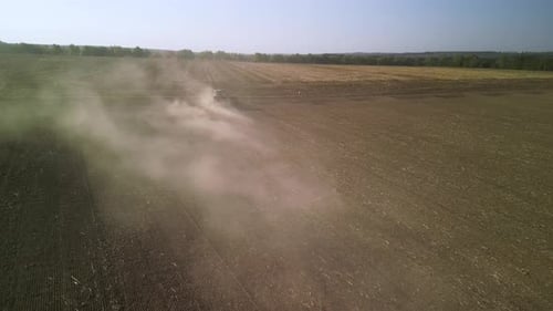 Tractor on the field seeding wheat
