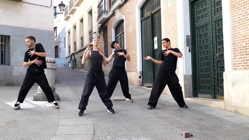 Group of Dancers Performing Urban Choreography on a City Street