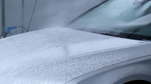 Washing Luxury Silver Car on Touchless Car Wash Washing Sedan Car with Foam Selfservice and High